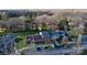 A residential street showcasing traditional homes with well-kept lawns and mature trees at 4351 Woodglen Ln, Charlotte, NC 28226
