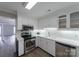 Modern kitchen showcasing white cabinets, stainless steel appliances, and subway tile backsplash for a clean and stylish look at 4351 Woodglen Ln, Charlotte, NC 28226