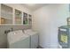 Functional laundry room featuring ample shelving and modern appliances for efficient and organized laundry care at 4351 Woodglen Ln, Charlotte, NC 28226