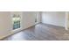 Bright living room featuring modern flooring and large windows, providing ample natural light and a welcoming atmosphere at 4351 Woodglen Ln, Charlotte, NC 28226