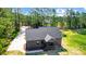 An aerial view of the home shows a well-maintained roof, complemented by lush greenery and a long driveway at 437 Cedar Grove Rd, Clover, SC 29710