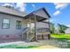 Charming back porch with stairs leading to backyard at 437 Cedar Grove Rd, Clover, SC 29710