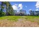 Spacious backyard with lush greenery and mature trees at 437 Cedar Grove Rd, Clover, SC 29710
