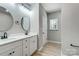 Modern bathroom features a double sink vanity with black fixtures and a framed mirror at 437 Cedar Grove Rd, Clover, SC 29710