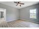 Bright bedroom with hardwood floors, a ceiling fan, and a window allowing for plenty of natural light at 437 Cedar Grove Rd, Clover, SC 29710