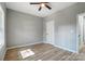 Light-filled bedroom featuring hardwood floors, a ceiling fan, and neutral walls at 437 Cedar Grove Rd, Clover, SC 29710