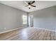 A bedroom with neutral colors, a ceiling fan and bright, natural light at 437 Cedar Grove Rd, Clover, SC 29710