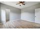 Bedroom featuring hardwood floors, a ceiling fan, and closet space, perfect for an organized and comfortable living at 437 Cedar Grove Rd, Clover, SC 29710