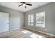 Bedroom featuring two windows, hardwood floors, and neutral wall paint allowing for natural light at 437 Cedar Grove Rd, Clover, SC 29710