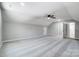 Spacious bonus room with neutral carpeting, ample windows, and a ceiling fan. Perfect for relaxation and entertaining at 437 Cedar Grove Rd, Clover, SC 29710