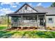 Inviting front porch with a cozy seating area and meticulous landscaping, enhancing the home's curb appeal at 437 Cedar Grove Rd, Clover, SC 29710