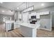 Well-lit kitchen featuring an island, stainless steel appliances, and white cabinetry at 437 Cedar Grove Rd, Clover, SC 29710