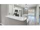 Open concept kitchen with stainless steel appliances, island, and sliding door to the deck at 437 Cedar Grove Rd, Clover, SC 29710