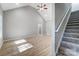 Bright living room with vaulted ceilings, sleek vinyl flooring, and a staircase leading to the upper level at 437 Cedar Grove Rd, Clover, SC 29710