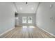 Bright living room featuring vaulted ceilings, vinyl floors, and a large doorway to the other rooms at 437 Cedar Grove Rd, Clover, SC 29710