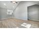Spacious living room with hardwood floors and an open layout to the kitchen and staircase at 437 Cedar Grove Rd, Clover, SC 29710