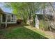 Landscaped backyard featuring a shed, providing ample storage space and outdoor living at 4501 Brandie Glen Rd, Charlotte, NC 28269
