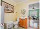Bathroom includes a single vanity with a framed mirror and commode near the hot water tank at 4501 Brandie Glen Rd, Charlotte, NC 28269