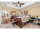 Main bedroom with tray ceilings, dark wood furniture, and view of well manicured backyard at 4501 Brandie Glen Rd, Charlotte, NC 28269