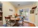 Cozy dining area adjacent to the kitchen features wood flooring and French doors to screened in porch at 4501 Brandie Glen Rd, Charlotte, NC 28269