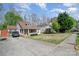 Exterior showing a charming home with well-manicured lawn and mature trees at 4501 Brandie Glen Rd, Charlotte, NC 28269