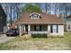 Charming single-story home featuring a welcoming front porch, tan siding, and well-maintained landscaping at 4501 Brandie Glen Rd, Charlotte, NC 28269