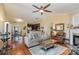 Open concept living room boasts hardwood floors, large windows and flows to the kitchen and dining area at 4501 Brandie Glen Rd, Charlotte, NC 28269