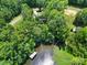 Overhead view showcasing property, lake access, and surrounding lush greenery at 463 Lake Wylie Rd, Belmont, NC 28012