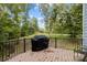 View of a back deck overlooking the spacious property, featuring a grill at 463 Lake Wylie Rd, Belmont, NC 28012