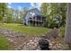 Exterior view of the property featuring a back deck, patio, and fire pit at 463 Lake Wylie Rd, Belmont, NC 28012