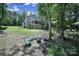 Home with a fire pit and Adirondack chairs, perfect for outdoor entertaining at 463 Lake Wylie Rd, Belmont, NC 28012