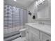 Nautical themed bathroom featuring a white vanity, and blue striped shower curtain at 463 Lake Wylie Rd, Belmont, NC 28012