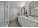 Elegant bathroom with double sinks, framed mirrors, and a glass-enclosed shower at 463 Lake Wylie Rd, Belmont, NC 28012