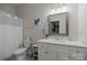 Bright bathroom with marble countertops, stylish vanity, framed mirror, and combined shower and tub at 463 Lake Wylie Rd, Belmont, NC 28012
