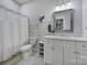 Clean and bright bathroom with white cabinets and a shower with curtain at 463 Lake Wylie Rd, Belmont, NC 28012