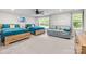 Bright bedroom with two wooden beds, a daybed, and ample natural light from the windows at 463 Lake Wylie Rd, Belmont, NC 28012