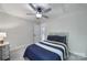 Comfortable bedroom with soft gray carpet, ceiling fan, and natural light at 463 Lake Wylie Rd, Belmont, NC 28012