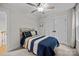 Comfortable bedroom showcasing a bed with wooden headboard, and a window with natural light at 463 Lake Wylie Rd, Belmont, NC 28012