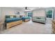 Spacious bedroom includes two beds, a futon, and natural light at 463 Lake Wylie Rd, Belmont, NC 28012