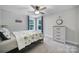 Bedroom featuring neutral walls, carpeted floors, ceiling fan, and lots of natural light at 463 Lake Wylie Rd, Belmont, NC 28012