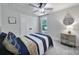 Cozy bedroom featuring neutral colors, a ceiling fan, and natural light from the window at 463 Lake Wylie Rd, Belmont, NC 28012