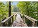 View of lake from the dock with Adirondack chairs and watercraft, perfect for enjoying waterfront living at 463 Lake Wylie Rd, Belmont, NC 28012