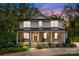 Charming two-story home with stone accents, covered porch, and manicured front yard at 463 Lake Wylie Rd, Belmont, NC 28012