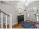 Bright foyer featuring hardwood floors, elegant lighting, and stylish decor at 463 Lake Wylie Rd, Belmont, NC 28012