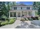 Charming stone front porch with chairs and steps leading to a well-landscaped yard at 463 Lake Wylie Rd, Belmont, NC 28012