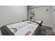 Spacious game room featuring an air hockey table and built-in shelving at 463 Lake Wylie Rd, Belmont, NC 28012