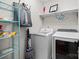 Practical laundry room with modern appliances and shelving for organization and storage at 463 Lake Wylie Rd, Belmont, NC 28012