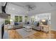 Open-concept living room showcasing fireplace, hardwood floors, and seamless flow to the kitchen at 463 Lake Wylie Rd, Belmont, NC 28012