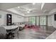 Open-concept living room featuring a large sectional couch, hardwood floors, and access to the outdoors at 463 Lake Wylie Rd, Belmont, NC 28012