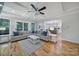 Open concept living room with a cozy sofa, fireplace, and view into the kitchen at 463 Lake Wylie Rd, Belmont, NC 28012
